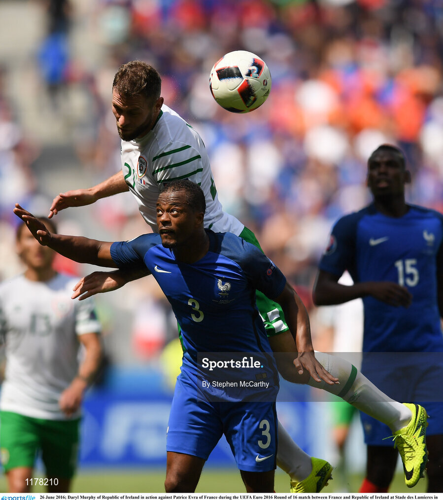 26 June 2016; Daryl Murphy of Republic of Ireland in action against Patrice Evra of France during the UEFA Euro 2016 Round of 16 match between France and Republic of Ireland at Stade des Lumieres in Lyon, France. Photo by Stephen McCarthy/Sportsfile