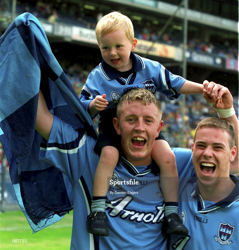 15 July 2001; Dublin players Martin Young and captain Barry Lyons, right, celebrate with young supporter Frankie Barr after the Leinster Minor Football Championship Final match between Dublin and Offaly in Croke Park, Dublin. Photo by Damien Eagers/Sportsfile