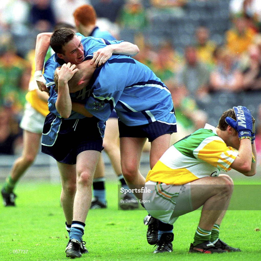 15 July 2001; Dublin players John Noonan and Padraig Brennan celebrate at the final whistle alongside a dejected Ronan Lally of Offaly during the Leinster Minor Football Championship Final match between Dublin and Offaly in Croke Park, Dublin. Photo by Damien Eagers/Sportsfile