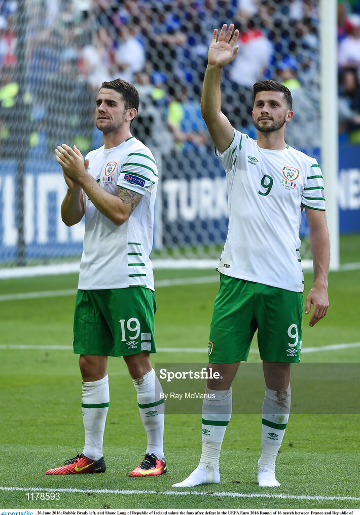 26 June 2016; Robbie Brady left, and Shane Long of Republic of Ireland salute the fans after defeat in the UEFA Euro 2016 Round of 16 match between France and Republic of Ireland at Stade des Lumieres in Lyon, France. Photo by Ray McManus/Sportsfile