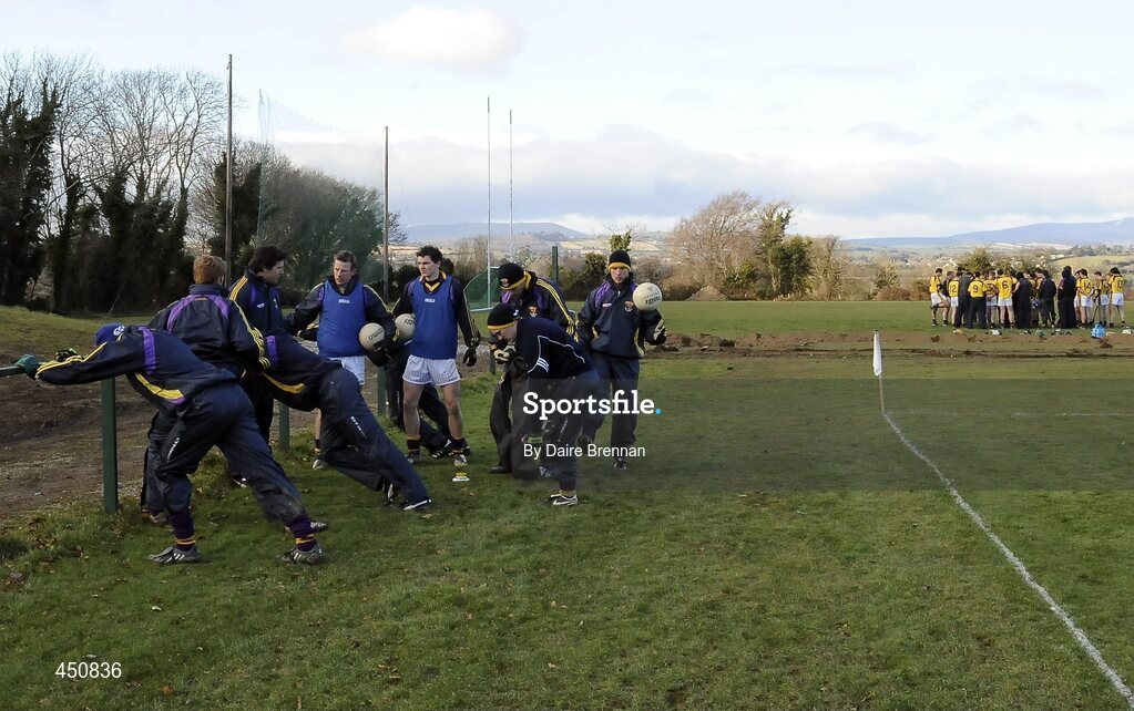 31 January 2010; Wexford football manager Jason Ryan speaks to some of the Wexford subs, while behind them, Wexford hurling manager Colm Bonnar speaks to the hurling side. O'Byrne Shield Semi-Final, Pairc Ui Siochan, Wexford v Westmeath, Gorey, Co. Wexford. Picture credit: Daire Brennan / SPORTSFILE