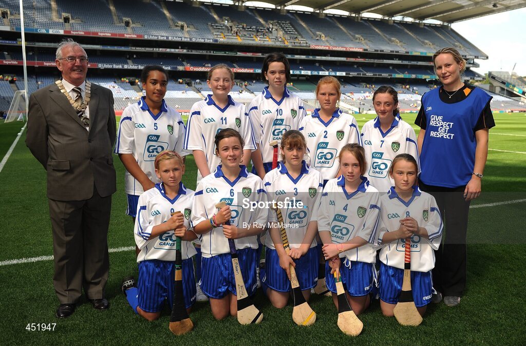 15 August 2010; President of the INTO Jim Higgins with the Waterford camogie team, back row, left to right; Elizabeth Kennedy, Ayle N.S., Monard, Co. Tipperary, Michelle O’Rourke, Laragh N.S., Stradone, Co. Cavan, Michaela McCloskey, St. John’s, Dernaflaw, Co. Derry, Beth Carton, Presentation Primary, Co. Waterford, Nadine Murphy, Scoil Fiachra S.N.S, Beaumont, Co. Dublin, front row, left to right, Sarah Marshall, Scoil Mhuire, Broadway, Co. Wexford, Claire Madden, Scoil Colmcille, Knocklyon, Co. Dublin, Sharon Williams, Bunscoil Bhothar na Naomh, Co. Waterford, Orlaith Dee, Ayle N.S., Monard, Co. Tipperary, Lauren Homan, Cloghroe N.S., Co. Cork. GAA Into Mini-Sevens during half time of the GAA Hurling All-Ireland Senior Championship Semi-Final, Waterford v Tipperary, Croke Park, Dublin. Picture credit: Ray McManus / SPORTSFILE