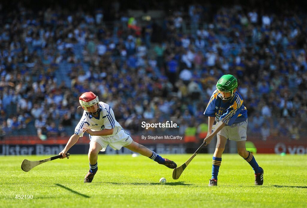 15 August 2010; Matthew Walsh, Larmenier and Sacred Heart P.S., London, representing Tipperary, shoots to score a goal despite John Mullins, Scoil Eoin Baiste S.N.S., Clontarf, Co. Dublin, representing Waterford. GAA INTO Mini-Sevens during half time of the GAA Hurling All-Ireland Senior Championship Semi-Final, Waterford v Tipperary, Croke Park, Dublin. Picture credit: Stephen McCarthy / SPORTSFILE