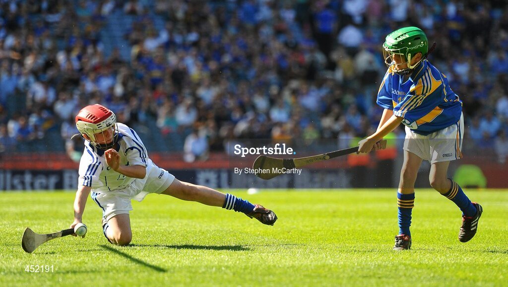 15 August 2010; Matthew Walsh, Larmenier and Sacred Heart P.S., London, representing Tipperary, shoots to score a goal despite John Mullins, Scoil Eoin Baiste S.N.S., Clontarf, Co. Dublin, representing Waterford. GAA INTO Mini-Sevens during half time of the GAA Hurling All-Ireland Senior Championship Semi-Final, Waterford v Tipperary, Croke Park, Dublin. Picture credit: Stephen McCarthy / SPORTSFILE