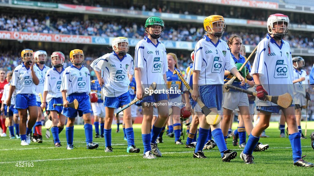 15 August 2010; Camogie players represenitng Waterford, from right, Nadine Murphy, Scoil Fiachra S.N.S, Beaumont, Co. Dublin, Sharon Williams, Bunscoil Bhothar na Naomh, Co. Waterford, Michelle O’Rourke, Laragh N.S., Stradone, Co. Cavan, Beth Carton, Presentation Primary, Co. Waterford, Sarah Marshall, Scoil Mhuire, Broadway, Co. Wexford, Orlaith Dee, Ayle N.S., Monard, Co. Tipperary, Claire Madden, Scoil Colmcille, Knocklyon, Co. Dublin, and Elizabeth Kennedy, Ayle N.S., Monard, Co. Tipperary, during the post-match parade. GAA INTO Mini-Sevens during half time of the GAA Hurling All-Ireland Senior Championship Semi-Final, Waterford v Tipperary, Croke Park, Dublin. Picture credit: Stephen McCarthy / SPORTSFILE