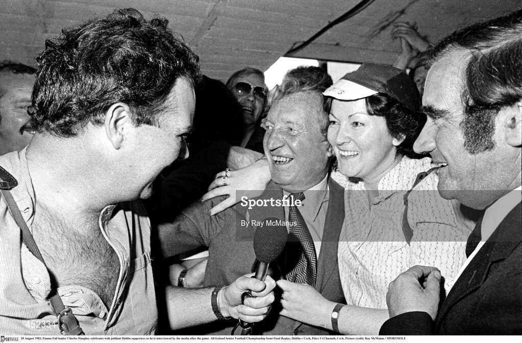 28 August 1983; Fianna Fáil leader Charles Haughey celebrates with jubilant Dublin supporters as he is interviewed by the media after the game. All-Ireland Senior Football Championship Semi-Final Replay, Dublin v Cork, Páirc Uí Chaoimh, Cork. Picture credit: Ray McManus / SPORTSFILE