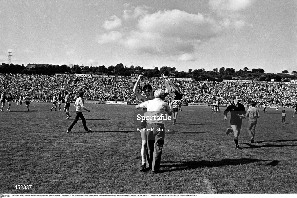 28 August 1983; Dublin captain Tommy Drumm is embraced by a supporter at the final whistle. All-Ireland Senior Football Championship Semi-Final Replay, Dublin v Cork, Páirc Uí Chaoimh, Cork. Picture credit: Ray McManus / SPORTSFILE