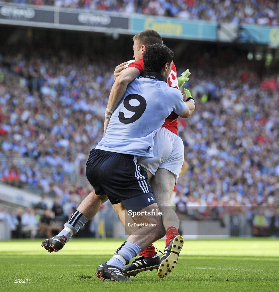 22 August 2010; Ross McConnell, Dublin, fouls Colm O'Neill, Cork, which led to a penalty being awarded by referee Maurice Deegan. GAA Football All-Ireland Senior Championship Semi-Final, Dublin v Cork, Croke Park, Dublin. Picture credit: David Maher / SPORTSFILE