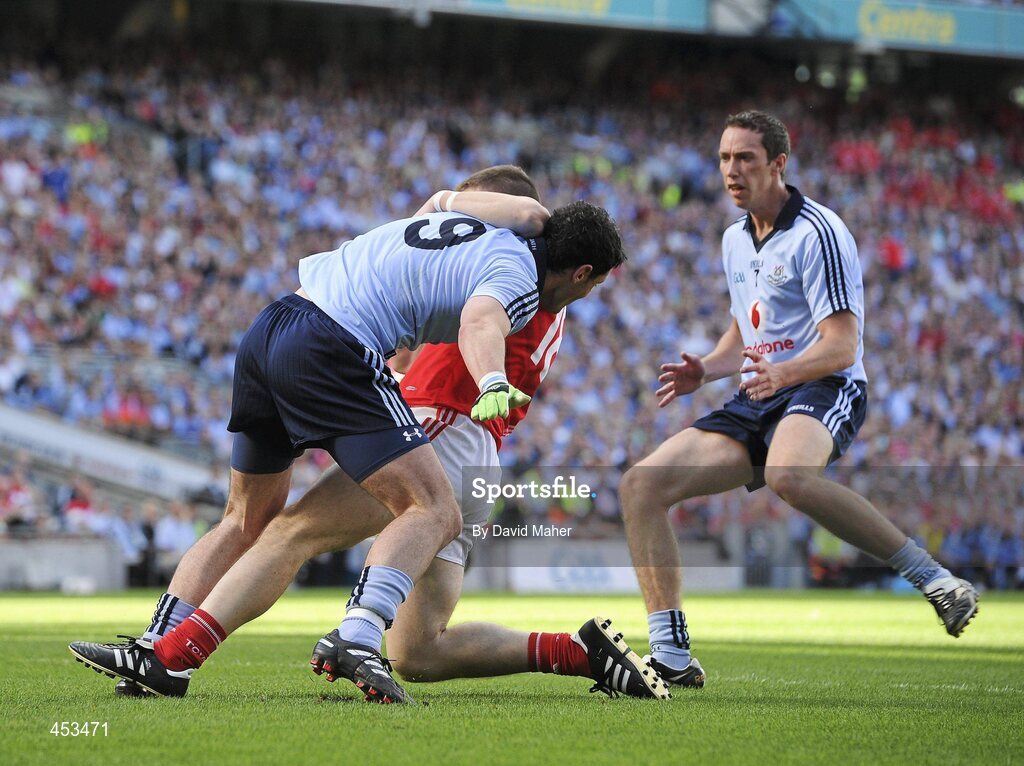 22 August 2010; Ross McConnell, Dublin, fouls Colm O'Neill, Cork, which led to a penalty being awarded by referee Maurice Deegan. GAA Football All-Ireland Senior Championship Semi-Final, Dublin v Cork, Croke Park, Dublin. Picture credit: David Maher / SPORTSFILE