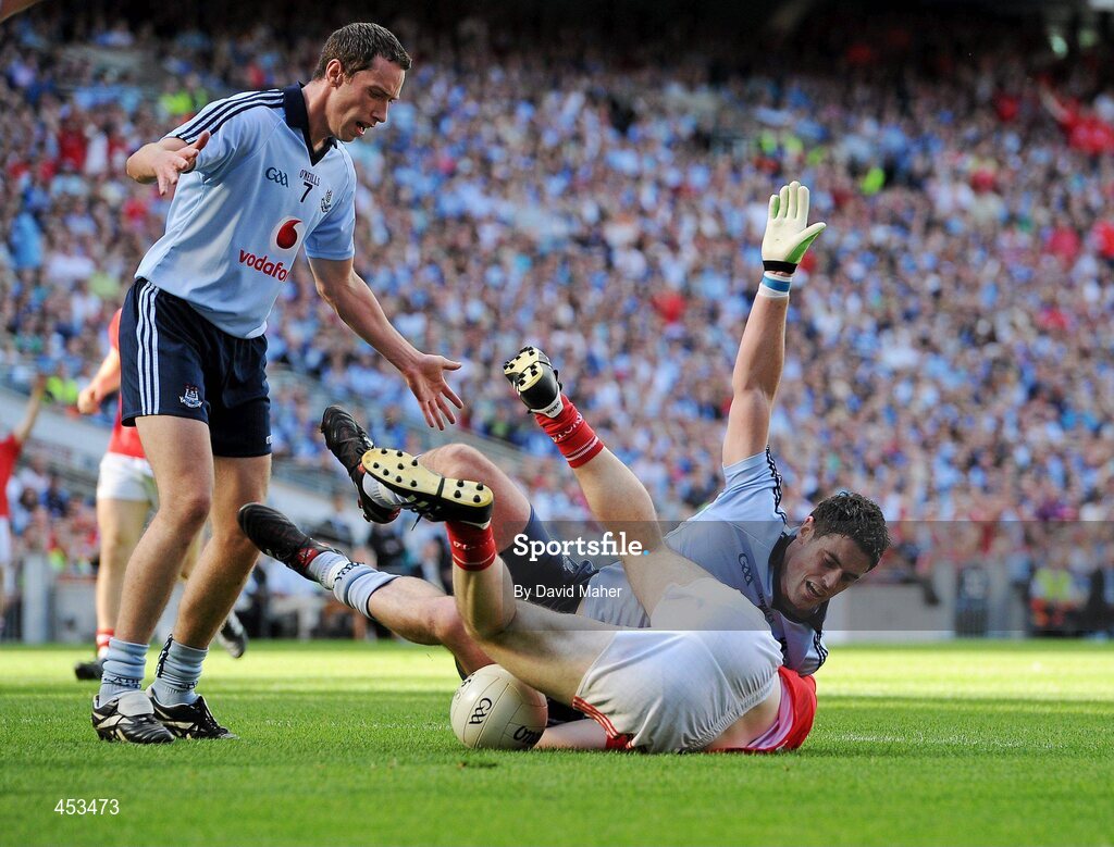 22 August 2010; Ross McConnell, Dublin, fouls Colm O'Neill, Cork, which led to a penalty being awarded by referee Maurice Deegan. GAA Football All-Ireland Senior Championship Semi-Final, Dublin v Cork, Croke Park, Dublin. Picture credit: David Maher / SPORTSFILE