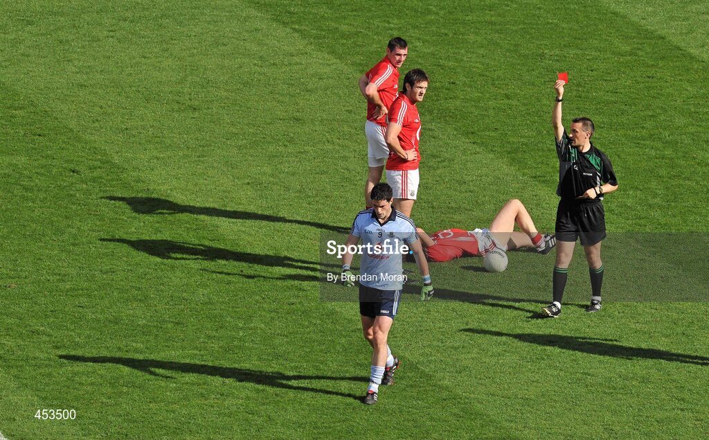 22 August 2010; Dublin's Ross McConnell is shown a red card, after receiving a second yellow, by referee Maurice Deegan after a tackle on Noel O'Leary, Cork. GAA Football All-Ireland Senior Championship Semi-Final, Dublin v Cork, Croke Park, Dublin. Picture credit: Brendan Moran / SPORTSFILE
