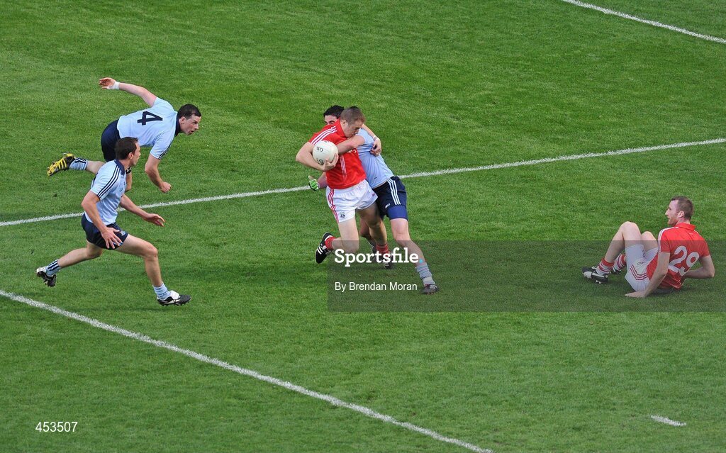 22 August 2010; Dublin's Ross McConnell tackles Cork's Colm O'Neill resulting in a penalty for Cork, from which they scored a goal. GAA Football All-Ireland Senior Championship Semi-Final, Dublin v Cork, Croke Park, Dublin. Picture credit: Brendan Moran / SPORTSFILE