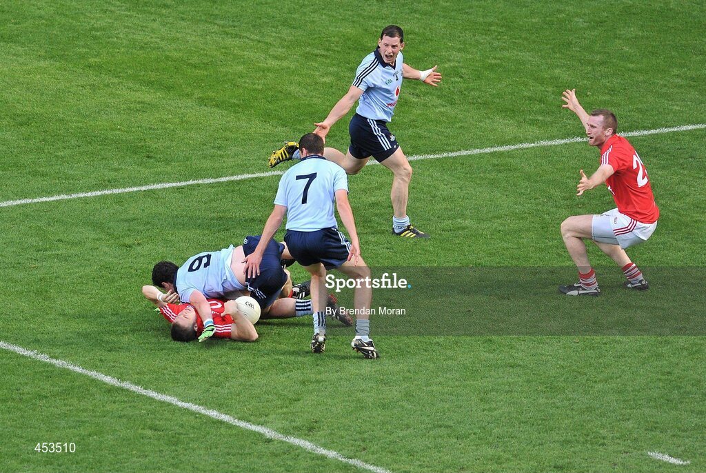 22 August 2010; Dublin's Ross McConnell tackles Cork's Colm O'Neill resulting in a penalty for Cork, from which they scored a goal. GAA Football All-Ireland Senior Championship Semi-Final, Dublin v Cork, Croke Park, Dublin. Picture credit: Brendan Moran / SPORTSFILE