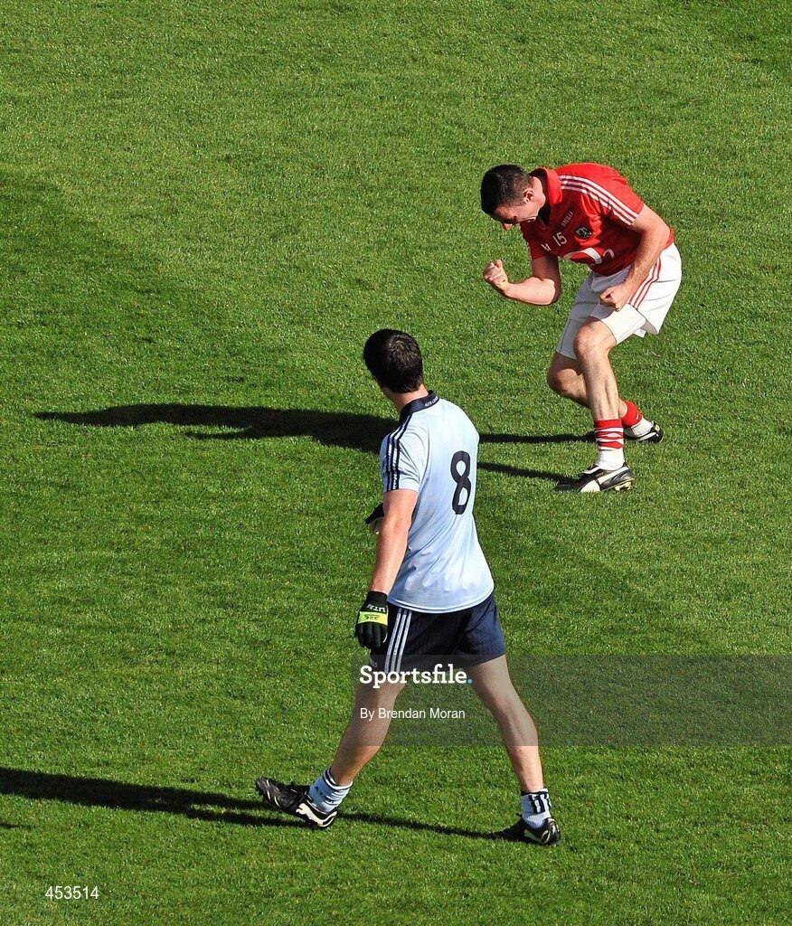22 August 2010; Cork's Donncha O'Connor celebrates after kicking a point from a free to give his side the lead in the last minute of normal time as Michael Daragh McAuley, Dublin, looks on. GAA Football All-Ireland Senior Championship Semi-Final, Dublin v Cork, Croke Park, Dublin. Picture credit: Brendan Moran / SPORTSFILE