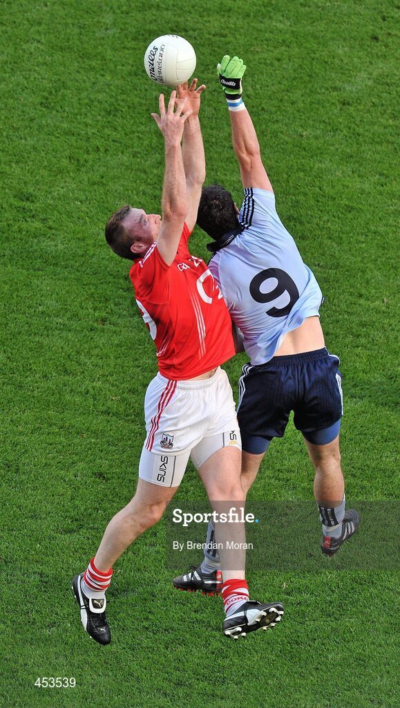 22 August 2010; Nicholas Murphy, Cork, fields a high ball ahead of Ross McConnell, Dublin. GAA Football All-Ireland Senior Championship Semi-Final, Dublin v Cork, Croke Park, Dublin. Picture credit: Brendan Moran / SPORTSFILE