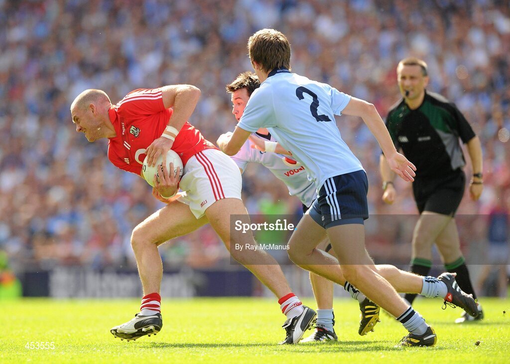 22 August 2010; Pearse O'Neill, Cork, in action against Michael Fitzsimons, 2, and Niall Corkery. GAA Football All-Ireland Senior Championship Semi-Final, Dublin v Cork, Croke Park, Dublin. Picture credit: Ray McManus / SPORTSFILE