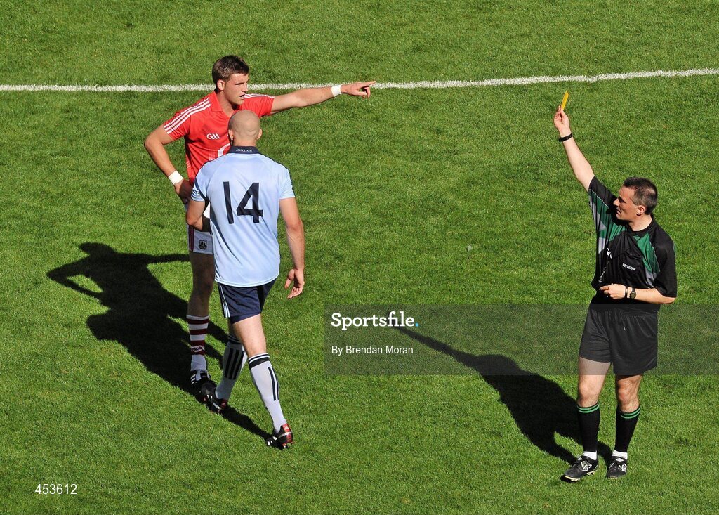 22 August 2010; Eoghan O'Gara, Dublin, is shown a yellow card by referee Maurice Deegan after an off the ball incident with Eoin Cadogan, Cork. GAA Football All-Ireland Senior Championship Semi-Final, Dublin v Cork, Croke Park, Dublin. Picture credit: Brendan Moran / SPORTSFILE