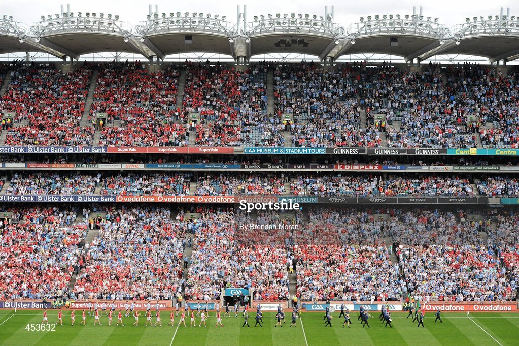 22 August 2010; The Cork and Dublin teams walk behind St Michael's Scout Band, Enniskillen, during the pre-match parade in front of the Cusack Stand before the game. GAA Football All-Ireland Senior Championship Semi-Final, Dublin v Cork, Croke Park, Dublin. Picture credit: Brendan Moran / SPORTSFILE