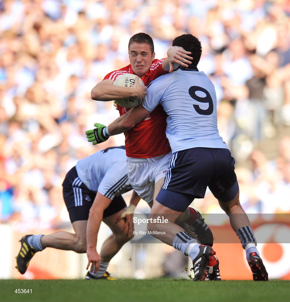 22 August 2010; Ross McConnell, Dublin, fouls Colm O'Neill, Cork, which resulted in a penalty for Cork. GAA Football All-Ireland Senior Championship Semi-Final, Dublin v Cork, Croke Park, Dublin. Picture credit: Ray McManus / SPORTSFILE