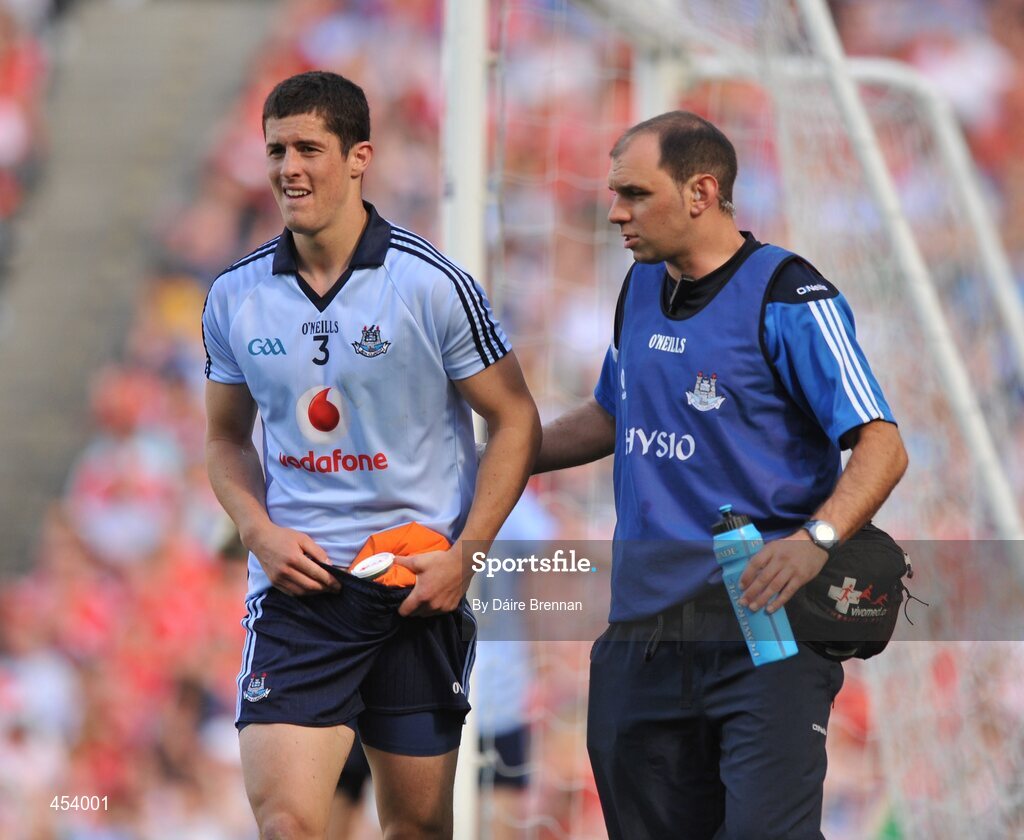 22 August 2010; Rory O'Carroll, Dublin, is escorted off the field after suffering an injury late in the game. GAA Football All-Ireland Senior Championship Semi-Final, Dublin v Cork, Croke Park, Dublin. Picture credit: Dáire Brennan / SPORTSFILE