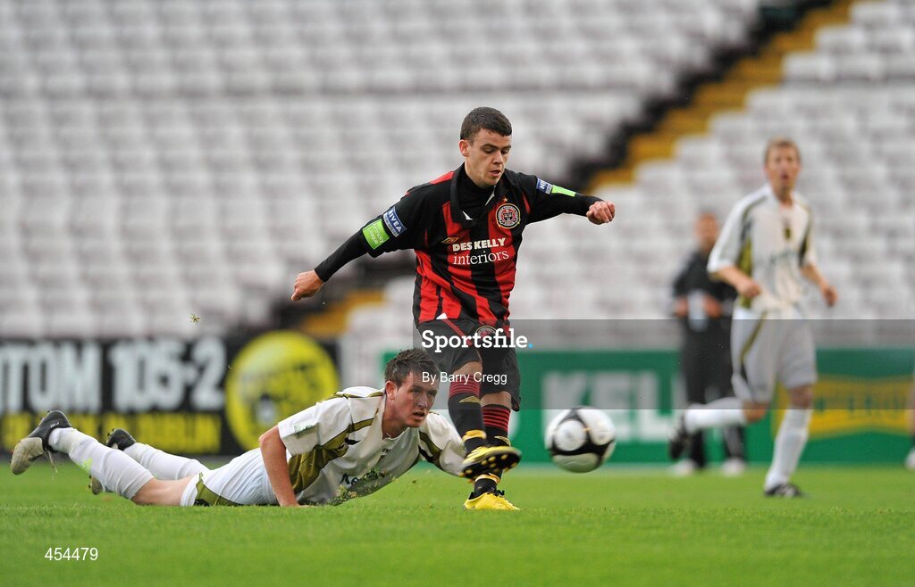 24 August 2010; Gary Burke, Bohemians A, gets past Jamie Duffy, Sporting Fingal A, to shoot and score his side's first goal. Newstalk Cup Final, Bohemians A v Sporting Fingal A, Dalymount Park, Dublin. Picture credit: Barry Cregg / SPORTSFILE