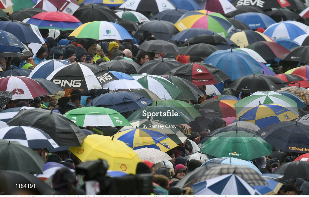10 July 2016; Supporters shelter from the rain during the Connacht GAA Football Senior Championship Final between Roscommon and Galway at Pearse Stadium in Galway. Photo by Ramsey Cardy/Sportsfile