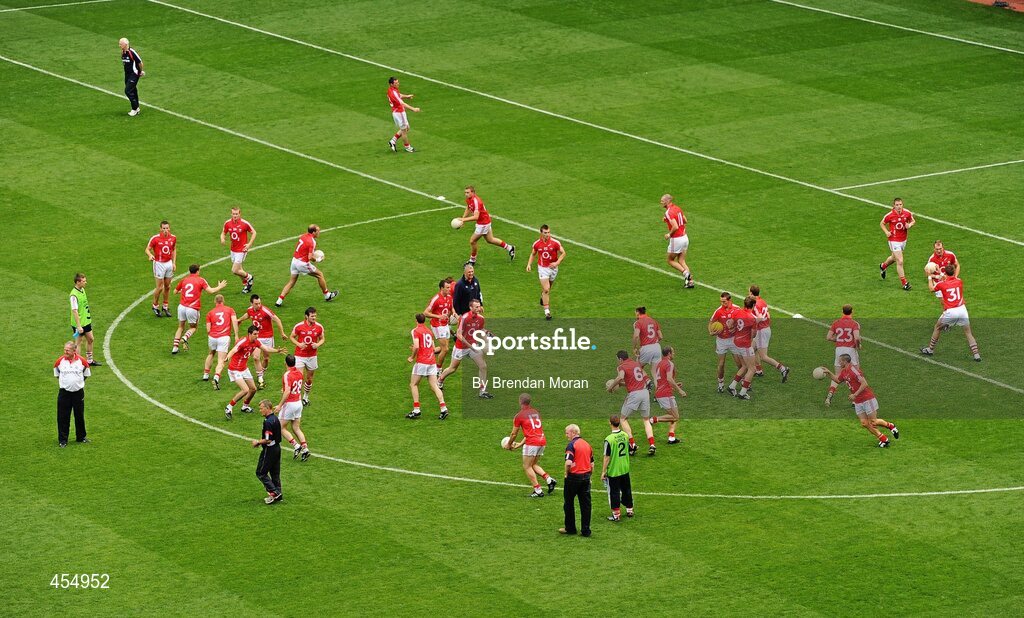 22 August 2010; The Cork team go through their warm-up routine as manager Conor Counihan, top left, walks by. GAA Football All-Ireland Senior Championship Semi-Final, Dublin v Cork, Croke Park, Dublin. Picture credit: Brendan Moran / SPORTSFILE