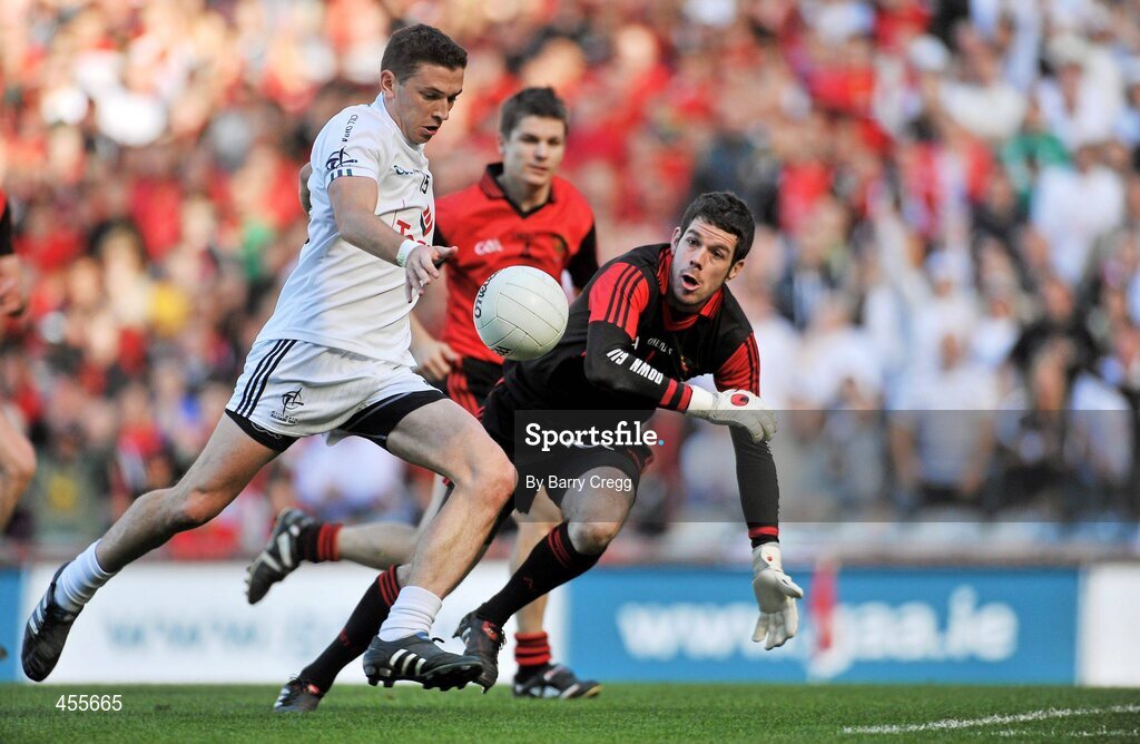 29 August 2010; Eamonn Callaghan, Kildare, shoots to score his side's first goal, despite the efforts of Brendan McVeigh, Down. GAA Football All-Ireland Senior Championship Semi-Final, Kildare v Down, Croke Park, Dublin. Picture credit: Barry Cregg / SPORTSFILE