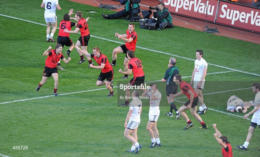 29 August 2010; Down players, including Damien Rafferty, Kevin McKernan, 6, Conor Maginn, 25, Benny Coulter, 13, Peter Fitzpatrick, 8, and James Colgan, 18, celebrate at the final whistle as dejected Kildare players react. GAA Football All-Ireland Senior Championship Semi-Final, Kildare v Down, Croke Park, Dublin. Picture credit: Brendan Moran / SPORTSFILE