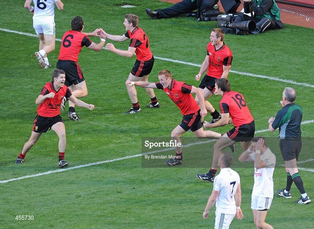 29 August 2010; Down players, including Damien Rafferty, Kevin McKernan, 6, Conor Maginn, 25, Benny Coulter, 13, Peter Fitzpatrick, 8, and James Colgan, 18, celebrate as referee Pat McEnaney blows the final whistle as dejected Kildare players react. GAA Football All-Ireland Senior Championship Semi-Final, Kildare v Down, Croke Park, Dublin. Picture credit: Brendan Moran / SPORTSFILE