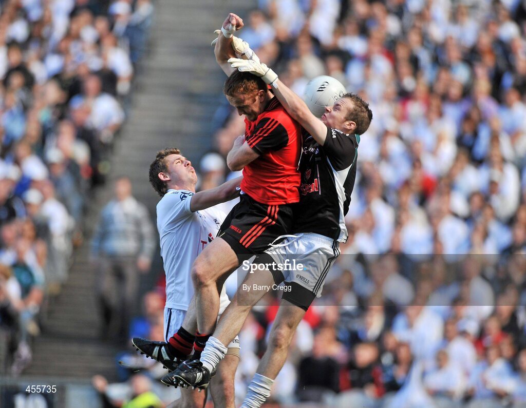 29 August 2010; Brendan Coulter, centre, Down, fists the ball past Emmet Bolton, left, Kildare and Shane McCormack, to score his side's first goal. GAA Football All-Ireland Senior Championship Semi-Final, Kildare v Down, Croke Park, Dublin. Picture credit: Barry Cregg / SPORTSFILE