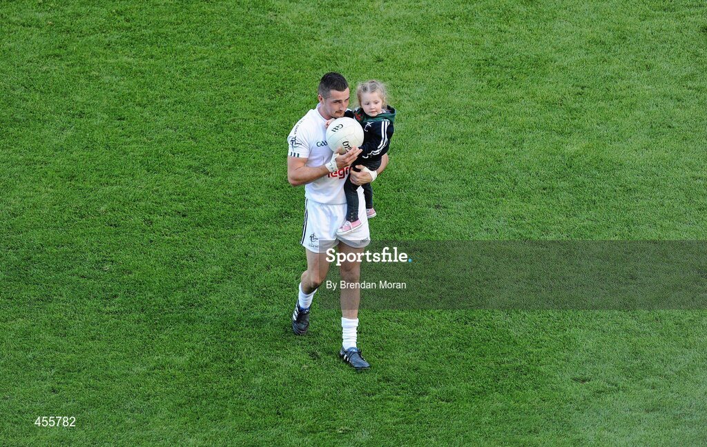 29 August 2010; Kildare's Aindriú Mac Lochlainn leaves the pitch after the game with his daughter Ella May after the game. GAA Football All-Ireland Senior Championship Semi-Final, Kildare v Down, Croke Park, Dublin. Picture credit: Brendan Moran / SPORTSFILE