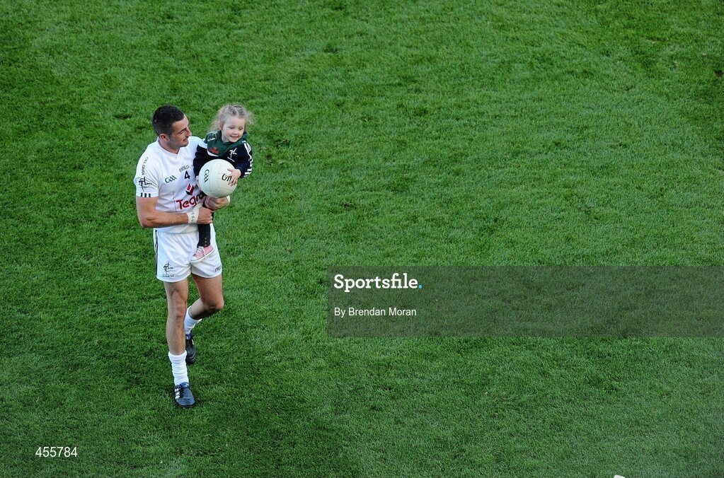 29 August 2010; Kildare's Aindriú Mac Lochlainn leaves the pitch after the game with his daughter Ella May after the game. GAA Football All-Ireland Senior Championship Semi-Final, Kildare v Down, Croke Park, Dublin. Picture credit: Brendan Moran / SPORTSFILE