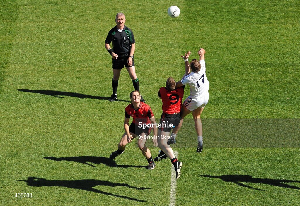 29 August 2010; Hugh Lynch, Kildare, contests a ball with Kalum King, 9, Down, as Peter Fitzpatrick, Down and referee Pat McEnaney look on. GAA Football All-Ireland Senior Championship Semi-Final, Kildare v Down, Croke Park, Dublin. Picture credit: Brendan Moran / SPORTSFILE