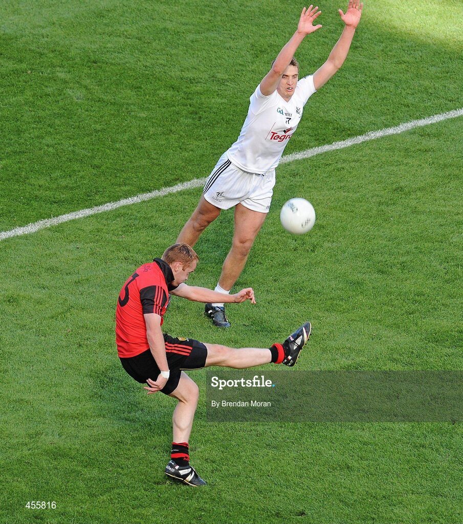 29 August 2010; Benny Coulter, Down, kicks a point despite the best efforts of Hugh Lynch, Kildare. GAA Football All-Ireland Senior Championship Semi-Final, Kildare v Down, Croke Park, Dublin. Picture credit: Brendan Moran / SPORTSFILE