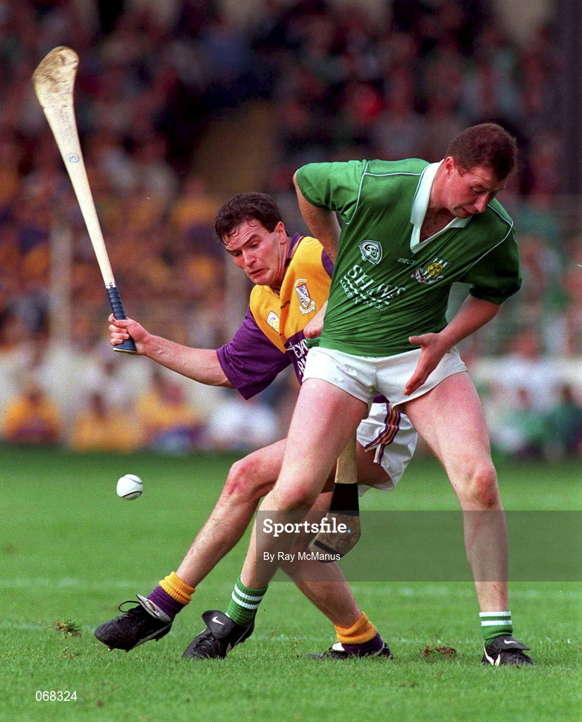 1 September 1996; Adrian Fenlon of Wexford in action against Frankie Carroll of Limerick during the Guinness All-Ireland Senior Hurling Championship Final match between Wexford and Limerick at Croke Park in Dublin. Photo by Ray McManus/Sportsfile