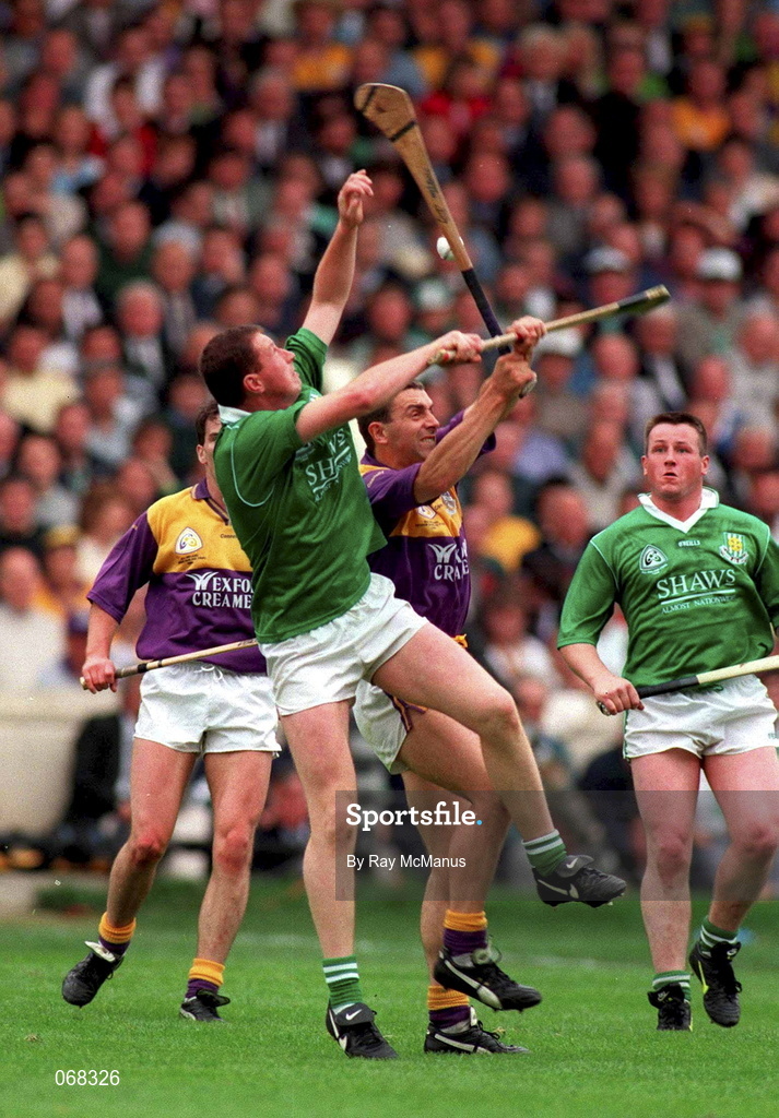 1 September 1996; Frankie Carroll of Limerick in action against Larry O'Gorman of Wexford during the Guinness All-Ireland Senior Hurling Championship Final match between Wexford and Limerick at Croke Park in Dublin. Photo by Ray McManus/Sportsfile