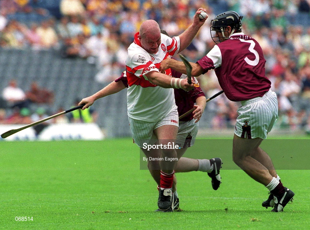 29 July 2001;  Geoffrey McGonagle of Derry in action against Michael Healy of Galway during the Guinness All-Ireland Senior hurling Championship Quarter-Final match between Galway and Derry at Croke Park in Dublin. Photo by Damien Eagers/Sportsfile