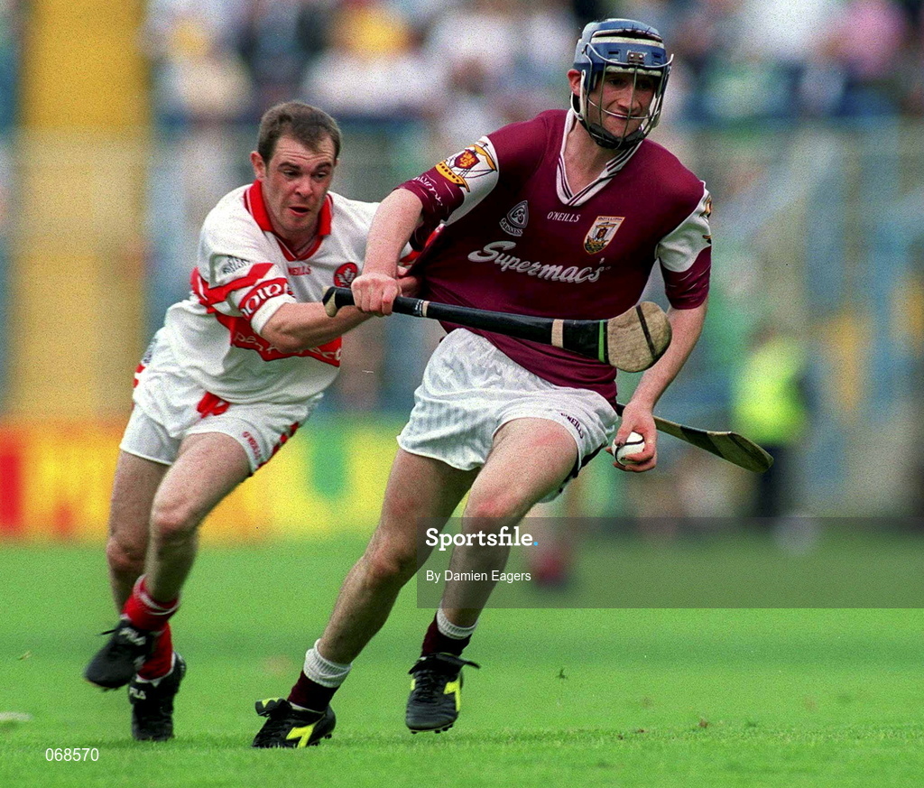 29 July 2001; Mark Kerins of Galway is tackled by Colin McEldowney of Derry during the Guinness All-Ireland Senior hurling Championship Quarter-Final match between Galway and Derry at Croke Park in Dublin. Photo by Damien Eagers/Sportsfile