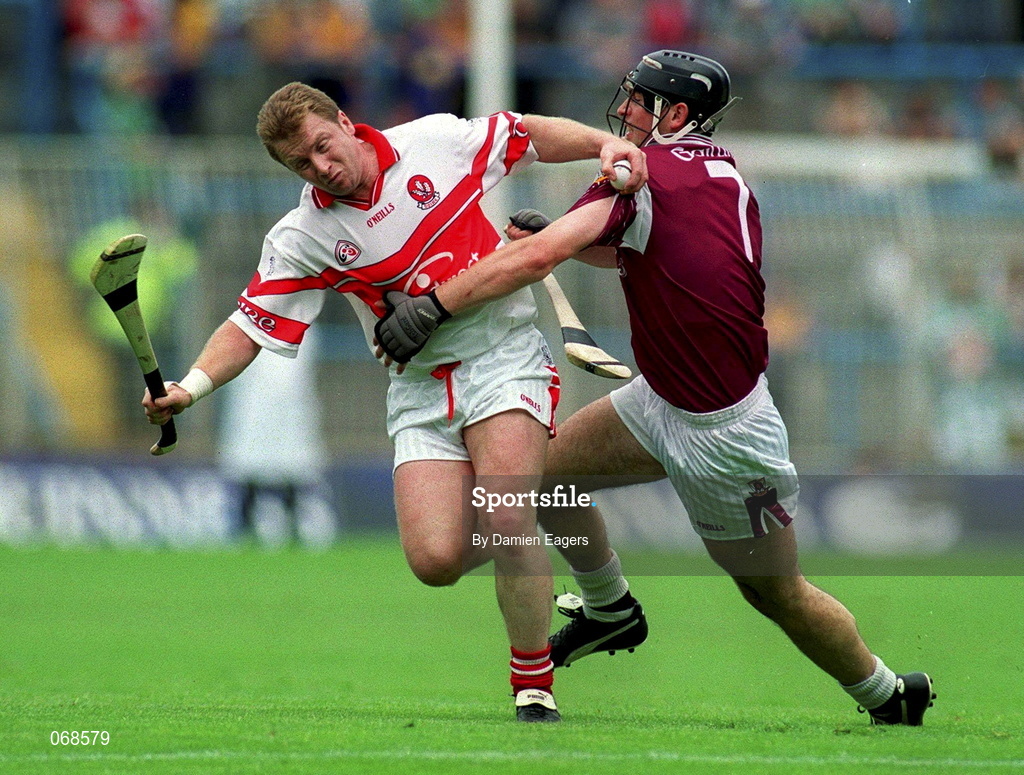 29 July 2001; Kieran McKeeveer of Derry is tackled by Cathal Moore of Galway during the Guinness All-Ireland Senior hurling Championship Quarter-Final match between Galway and Derry at Croke Park in Dublin. Photo by Damien Eagers/Sportsfile