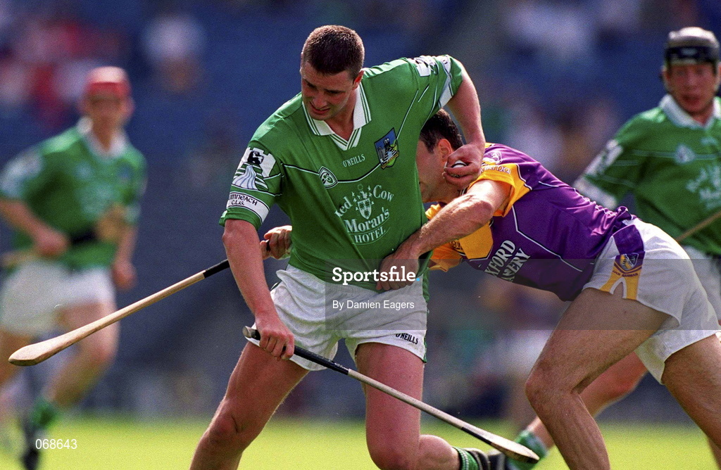 29 July 2001; Brian Begley of Limerick attempts to get away from Darragh Ryanof Wexford during the Guinness All-Ireland Senior Hurling Championship Quarter-Final match between Wexford and Limerick at Croke Park in Dublin. Photo by Damien Eagers/Sportsfile