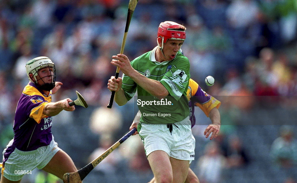 29 July 2001; Ollie Moran of Limerick in action against David O'Connor, left, and Liam Dunne of Wexford during the Guinness All-Ireland Senior Hurling Championship Quarter-Final match between Wexford and Limerick at Croke Park in Dublin. Photo by Damien Eagers/Sportsfile