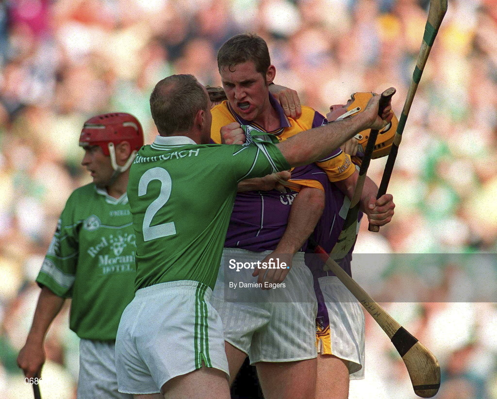 29 July 2001; Nicky Lambert of Wexford tussles with Stephen McDonagh of Limerick during the Guinness All-Ireland Senior Hurling Championship Quarter-Final match between Wexford and Limerick at Croke Park in Dublin. Photo by Damien Eagers/Sportsfile