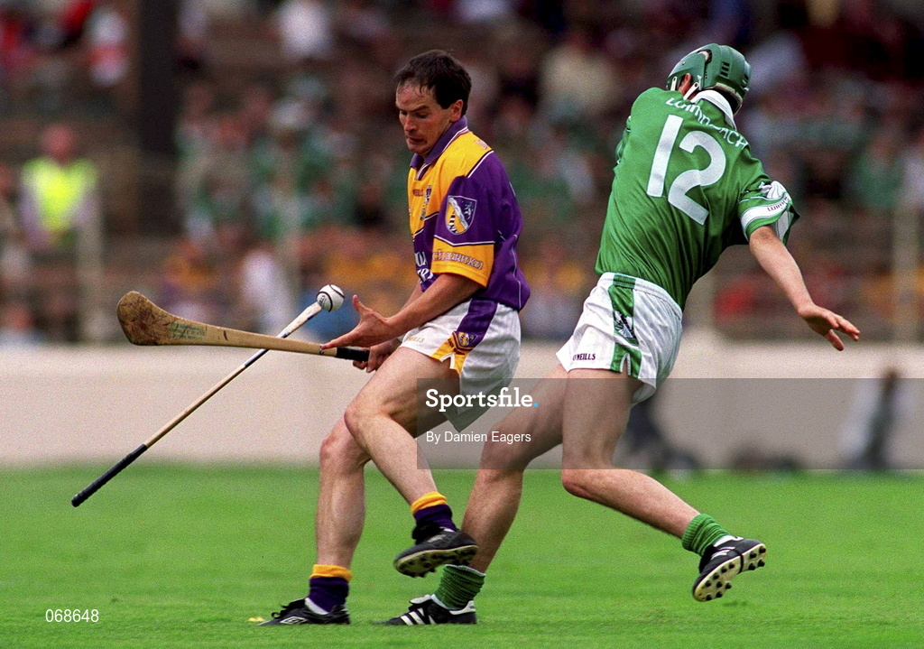 29 July 2001; Adrian Fenlon of Wexford in action against Mike O'Brien of Limerick during the Guinness All-Ireland Senior Hurling Championship Quarter-Final match between Wexford and Limerick at Croke Park in Dublin. Photo by Damien Eagers/Sportsfile