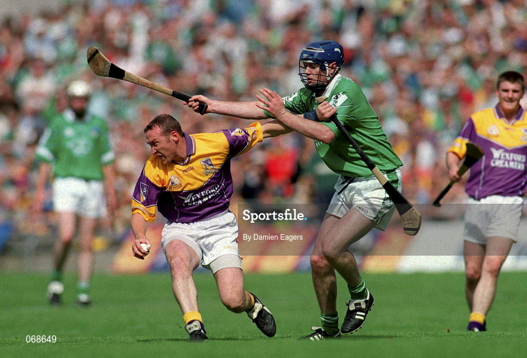 29 July 2001; Larry Murphy of Wexford in action against Brian Geary of Limerick during the Guinness All-Ireland Senior Hurling Championship Quarter-Final match between Wexford and Limerick at Croke Park in Dublin. Photo by Damien Eagers/Sportsfile