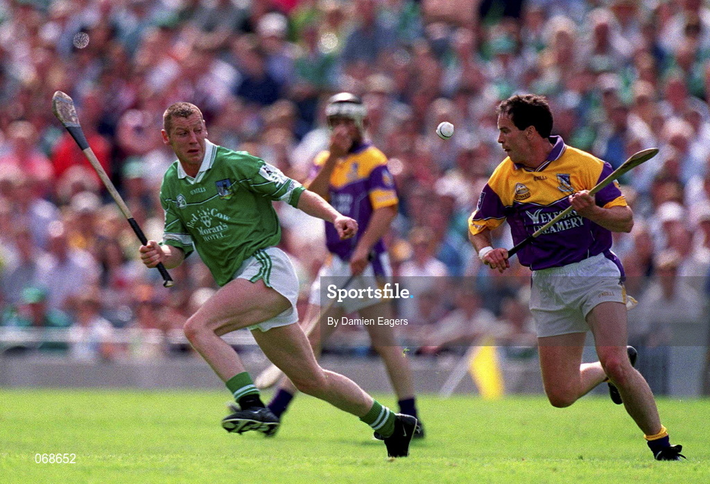 29 July 2001; Adrian Fenlon of Wexford in action against Ciaran Carey of Limerick during the Guinness All-Ireland Senior Hurling Championship Quarter-Final match between Wexford and Limerick at Croke Park in Dublin. Photo by Damien Eagers/Sportsfile