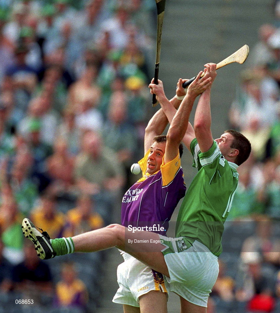 29 July 2001; Darragh Ryan of Wexford contests a dropping ball with Brian Begley of Limerick during the Guinness All-Ireland Senior Hurling Championship Quarter-Final match between Wexford and Limerick at Croke Park in Dublin. Photo by Damien Eagers/Sportsfile
