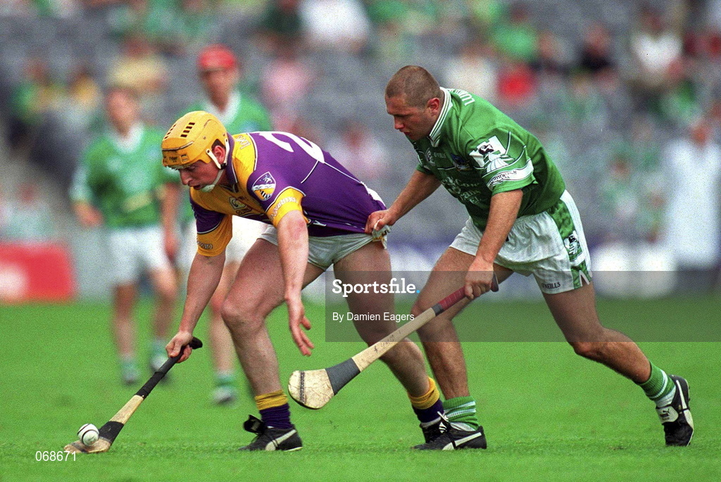 29 July 2001; Garry Laffan of Wexford in action against Clement Smith of Limerick during the Guinness All-Ireland Senior Hurling Championship Quarter-Final match between Wexford and Limerick at Croke Park in Dublin. Photo by Damien Eagers/Sportsfile