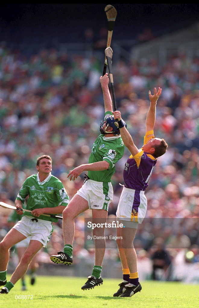 29 July 2001; Brian Geary of Limerick in action against Larry Murphy of Wexford during the Guinness All-Ireland Senior Hurling Championship Quarter-Final match between Wexford and Limerick at Croke Park in Dublin. Photo by Damien Eagers/Sportsfile