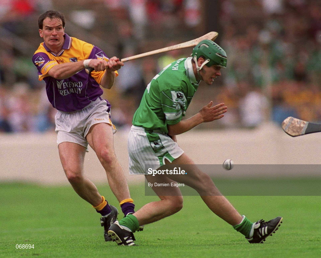 29 July 2001; Adrian Fenlon of Wexford in action against Mike O'Brien of Limerick during the Guinness All-Ireland Senior Hurling Championship Quarter-Final match between Wexford and Limerick at Croke Park in Dublin. Photo by Damien Eagers/Sportsfile